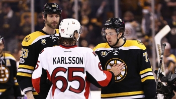 Charlie McAvoy and Zdeno Chara shake hands with Ottawa&#039;s Erik Karlsson after Game 6 playoff loss.